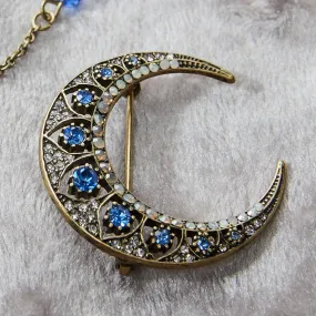 Crescent moon brooch