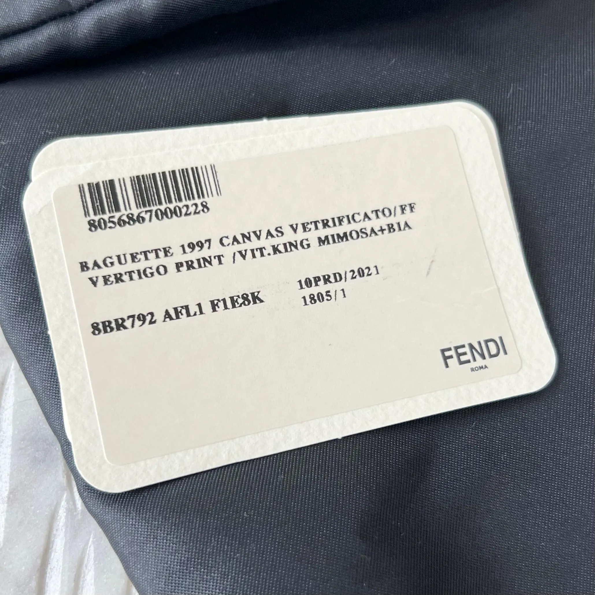 Sure, a more optimized title for this e-commerce product could be: FENDI x Sarah Coleman FF Vertigo Baguette Bag - Stylish Limited Edition Design