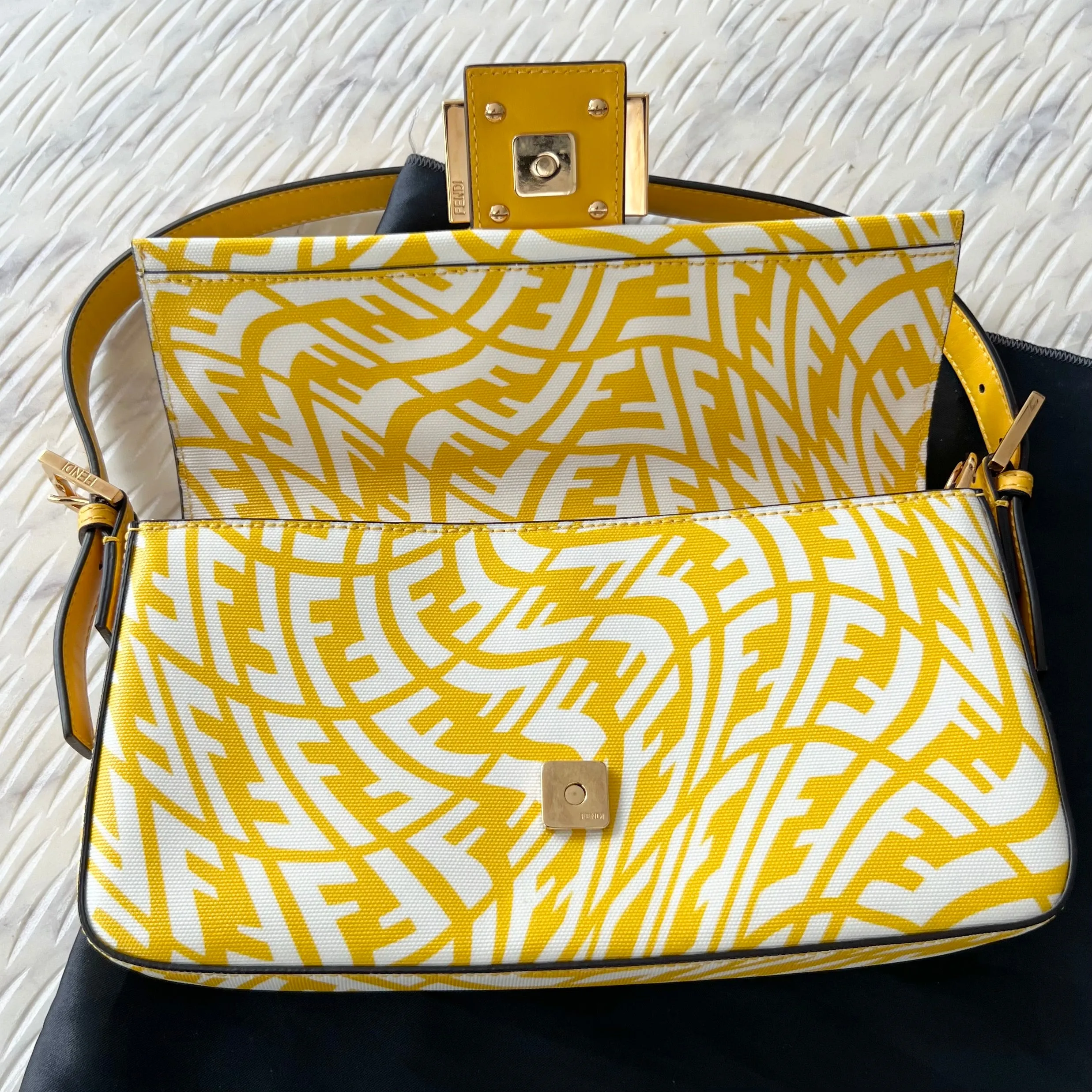 Sure, a more optimized title for this e-commerce product could be: FENDI x Sarah Coleman FF Vertigo Baguette Bag - Stylish Limited Edition Design