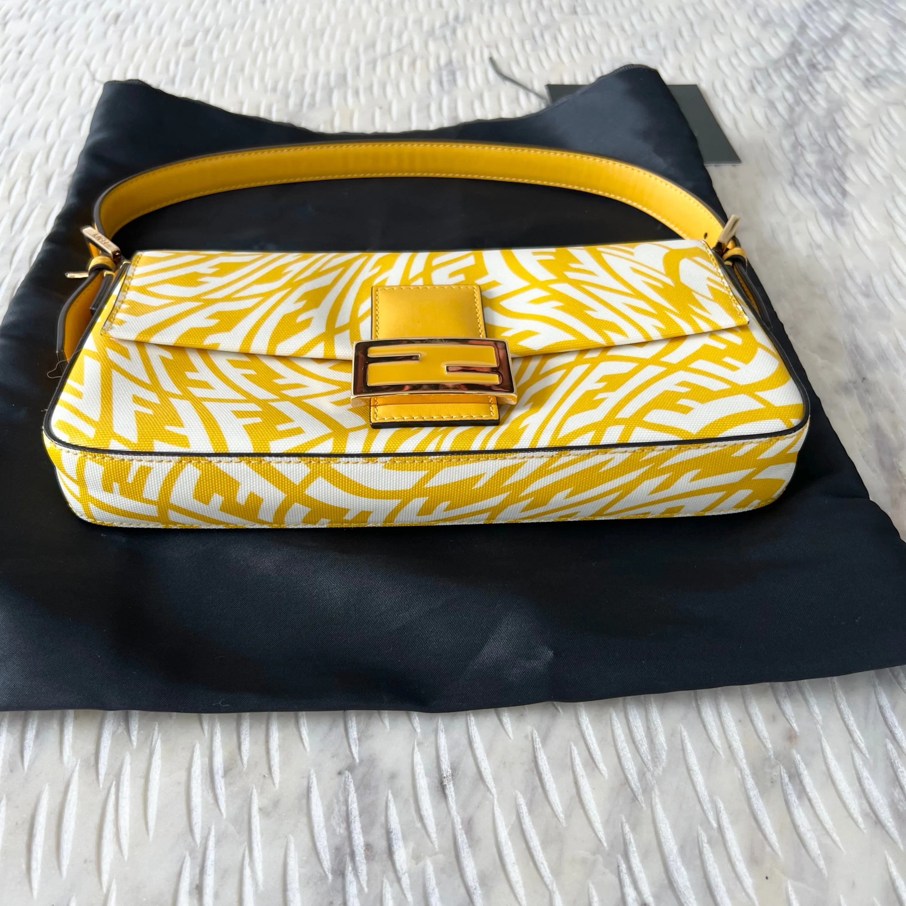 Sure, a more optimized title for this e-commerce product could be: FENDI x Sarah Coleman FF Vertigo Baguette Bag - Stylish Limited Edition Design