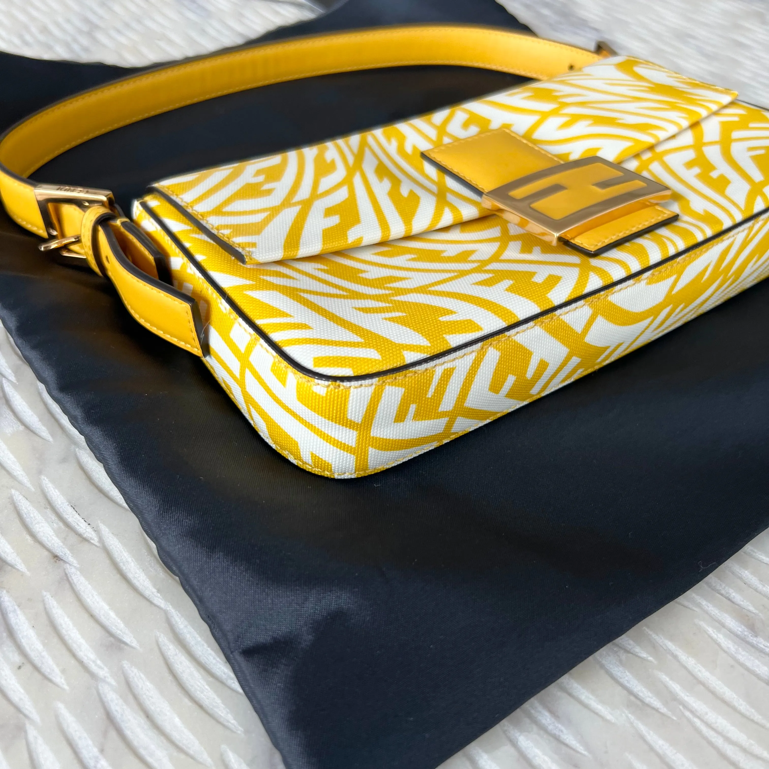 Sure, a more optimized title for this e-commerce product could be: FENDI x Sarah Coleman FF Vertigo Baguette Bag - Stylish Limited Edition Design